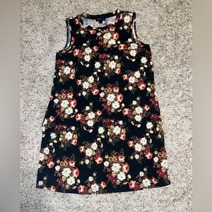 Large strapless floral dress with pockets stretchy material. Mid thigh length